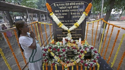 An Indian woman pays tribute at a memorial for victims on the fifth anniversary of the Mumbai terror attacks, at Cama hospital, Mumbai. Divyakant Solanki / EPA