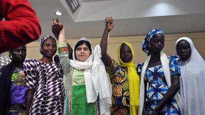 Pakistani education activist Malala Yousafzai, third from left, with five Chibok schoolgirls – Rebecca Ishaku, Kanna Bitrus, Hauwa John, Hauwa Musa and Hawa Alhl’ama – who were released by Boko Haram captors in May, a month after 276 girls were taken by the Nigerian militant group. The girls faced forced conversion and marriage. Isaac Babatunde / AFP