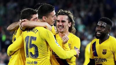 Barcelona's Clement Lenglet celebrates with teammates after scoring against Real Betis. EPA