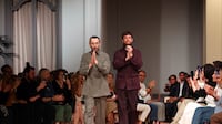 Alessandro Sartori, left, at the Zegna show in Dubai with singer James Blake. Chris Whiteoak / The National