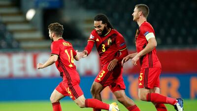 Mertens, left, celebrates with teammates after scoring. AP