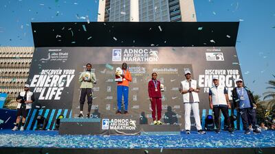 Dr Sultan al Jaber, Minister of Industry and Advanced Technology and Adnoc's group chief executive, honours Kenyan-born Bahraini athlete Eunice Chumba and winners of the Adnoc Abu Dhabi Marathon on Saturday. Wam