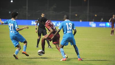 Al Wahda's Amer Omar looks for a way through the Dibba back line. Pic: Al Ittihad.