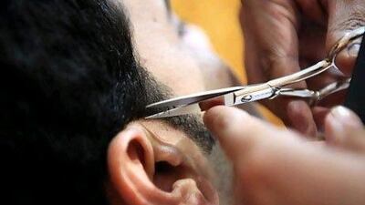 Haircuts are the ultimate economic indicator, a Goldman Sachs banker says. Galen Clarke / The National