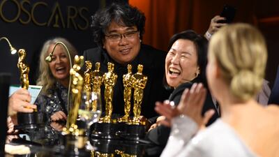 Bong Joon-ho, producer Kwak Sin-ae and Renee Zellweger have a laugh at the Governors Ball after the Oscars on Sunday, February 9, 2020, at the Dolby Theatre in Los Angeles. AFP