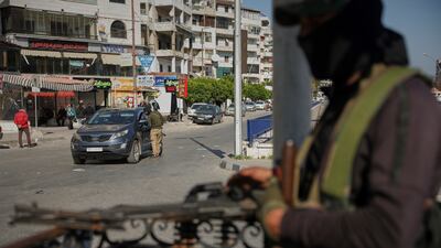Syrian security forces inspect vehicles at a checkpoint in Latakia after recent sectarian violence. AP