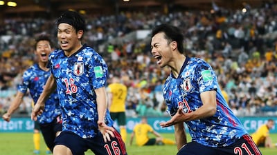 Japan's Kaoru Mitoma celebrates after scoring against Australia in the World Cup qualifier at Accor Stadium in Sydney, on March 24, 2022. Japan qualified for the finals in Qatar after the 2-0 victory. Getty