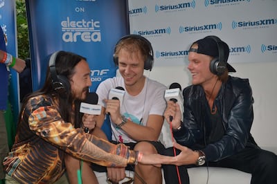 From left, DJs Steve Aoki, Armin van Buuren and Avicii in Miami, Florida, in 2013. Getty