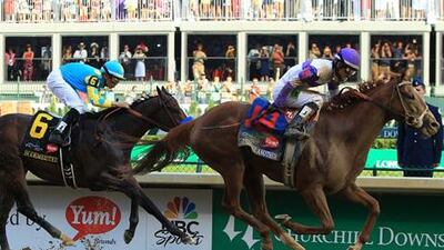 LOUISVILLE, KY - MAY 05: Mario Gutierrez celebrates atop I'll Have Another after winning the 138th running of the Kentucky Derby ahead of Bodemeister ridden by Mike Smith at Churchill Downs on May 5, 2012 in Louisville, Kentucky. Travis Lindquist/Getty Images/AFP== FOR NEWSPAPERS, INTERNET, TELCOS & TELEVISION USE ONLY ==