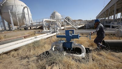 An employee at the Bai Hassan oilfield. Ahmad Al Rubaye/AFP