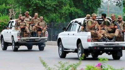 Pakistani soldiers patrol outside the Pakistan Air Force base at Minhas after militants with guns and rocket launchers stormed another key base in Kamra.