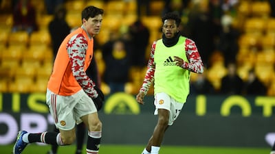 Manchester United's Swedish defender Victor Lindelof and Fred warm up. AFP