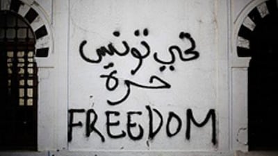 Revolutionary graffiti adorns a wall of the prime minister’s office in Tunis on January 22.