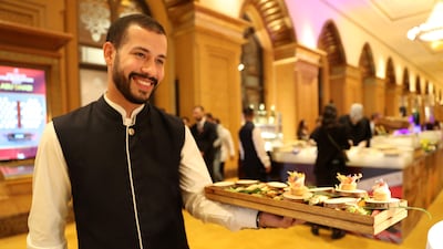 A waiter serves canapes ahead of the unveiling.