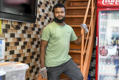 Mohammed Abdulraheem, 31, from Bangladesh has been working at African Nice Restaurant, Tourist Club Area for the past 11 years. Khushnum Bhandari / The National