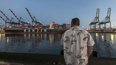 A longshoreman at the Port of Los Angeles. US workers are worried trade agreements will cost them their jobs. Damian Dovarganes / AP Photo