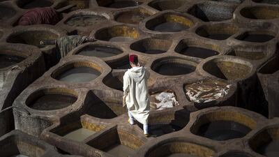 A Moroccan man walks in the tannery in the 9th century walled medina in the ancient city of Fez. AFP