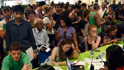 Passengers gather at the Gusti Ngurah Rai International airport in Denpasar, Bali on Monday after flights were cancelled due to the threat of a major eruption by the Mount Agung volcano. Ash clouds have already made take-off and landing too dangerous, the authorities said. Yuda Riyanto / AFP