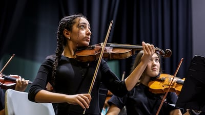Violinist Renee Youssef, 14, during the final rehearsals of the National Youth Orchestra of Dubai before the group head to perform at Carnegie Hall. Victor Besa / The National