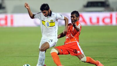 Wasl look for a way through the Ajman defence. Afsal Sham