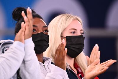 Simone Biles watches the artistic gymnastics women's all-around final