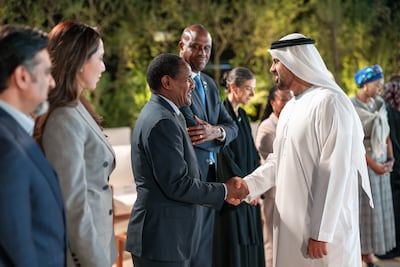 Sheikh Theyab bin Mohamed, deputy chairman of the Presidential Court for Development and Fallen Heroes’ Affairs, and chairman of Erth Zayed Philanthropies, greets Dr Oumer Hussien, Ethiopia's ambassador to the UAE. Photo: Abu Dhabi Media Office