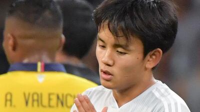 Japan's Takefusa Kubo reacts after a VAR-check disallowed his goal against Ecuador. AFP