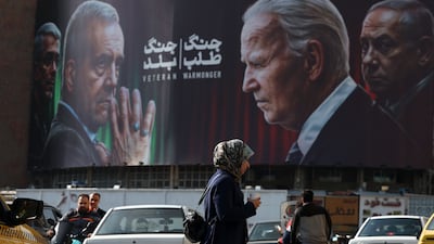A billboard with pictures of Iranian President Masoud Pezeshkian, US President Joe Biden and Israeli Prime Minister Benjamin Netanyahu at Valiasr Square in Tehran this week. EPA