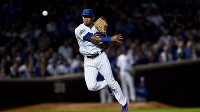 Chicago Cubs' Addison Russell throws to first base in a play-off game against the San Francisco Giants. Stacy Revere/AFP