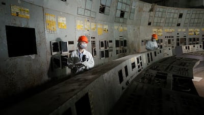 Visitors in the control room of the plant's fourth reactor at the Chernobyl nuclear power plant, in Chernobyl, Ukraine, 23 April 2026. EPA