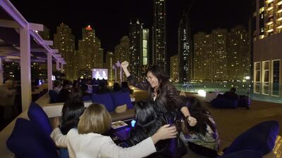 People celebrate Dubai's victory at The Shades Lounge at The Address Hotel in Dubai Marina. Jaime Puebla / The National