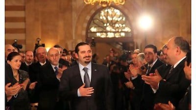 Lebanon's caretaker Prime Minister Saad al Hariri greets his supporters before a news conference in Beirut.