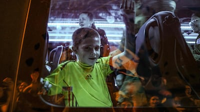Tal Almog-Goldstein in a bus after he was released by Hamas. AFP