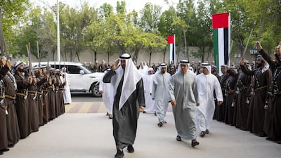 President Sheikh Mohamed, left, arrives at the wedding reception of Sheikh Zayed bin Tahnoon bin Mohammed. Hamad Al Kaabi / UAE Presidential Court