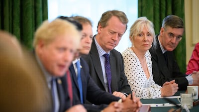 Minister for Brexit Opportunities and Government Efficiency in the Cabinet Office Jacob Rees-Mogg (right), Culture Secretary Nadine Dorries (second right) and Scottish Secretary Alister Jack (third right) listen as Prime Minister Boris Johnson (left) chairs a Cabinet meeting at 10 Downing Street, London, on June 7. PA Wire