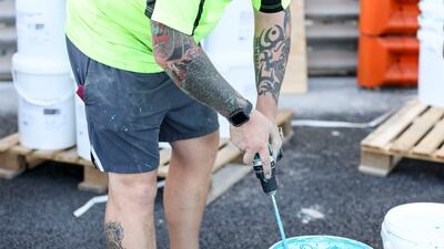 Paint is mixed before it's applied to the track. Khushnum Bhandari / The National