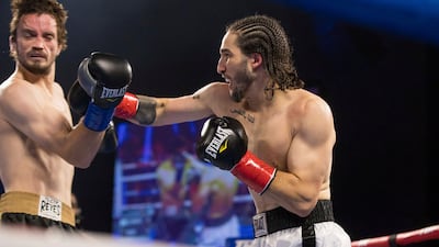 Nico Ali Walsh, right, hits Jordan Weeks during their middleweight clash on Saturday.