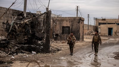 Syrian Democratic soldiers on patrol near theprison attacked by ISIS in Hassakeh, Syria. AP