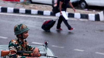 Security personnel stand guard a street in Jammu on August 5, 2019. AFP