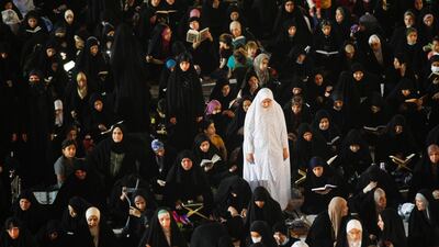 Shiite worshipers read the Quran during Ramadan at the Great Mosque of Kufa, Iraq. Reuters