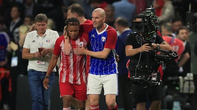 Zinedine Zidane of the France 98 team and FIFA 98’s Edgar Davids congratulate each other at the end of the match. Zidane and Davids formed a formidable midfield partnership at Juventus in the 90s. Gonzalo Fuentes / Reuters