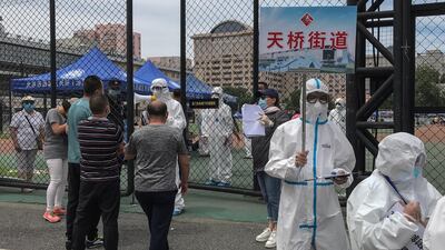 Local residents, who visited or live near Xinfadi Market, queue for a Covid-19 test at Guang'an Sport Centre in Beijing, China. EPA