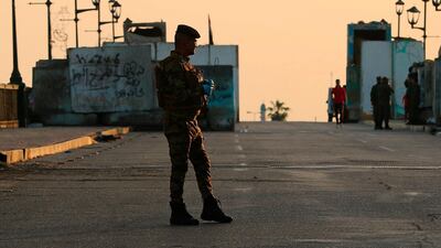 A policeman mans a checkpoint near the Tigris River in Baghdad, Iraq. AP Photo