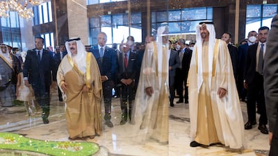 President Sheikh Mohamed and King Hamad view the model.