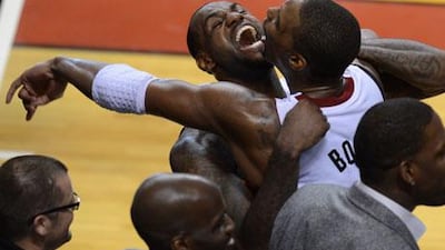 LeBron James, left, won his first NBA title since joining the league in 2003. Don Emmert / AFP