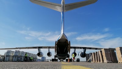 A cargo plane bound for Delhi waits on the tarmac at Helsinki airport in Finland on May 11, 2021 to be loaded with oxygen tanks and ventilators, which Indian hospitals are badly in need of, under an EU aid scheme. AFP