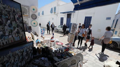 Tourists explore the village