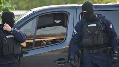 Policemen secure an area in Dubona, one of the villages where the shooter opened fire, about 60 kilometres south of Belgrade. AFP