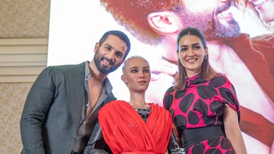 Bollywood stars Shahid Kapoor and Kriti Sanon with humanoid robot Sophia at a press conference in Dubai. Leslie Pableo for The National