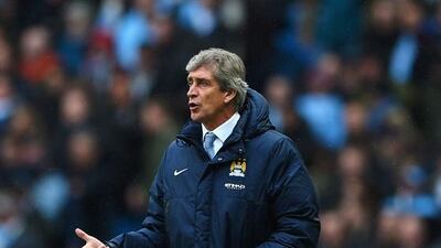 Manuel Pellegrini, pictured during the English Premier League match between Manchester City and Fulham at Etihad Stadium on March 22, 2014, has Manchester City in the rare position of being favourites as they travel to Old Trafford to face rivals Manchester United. Michael Regan / Getty Images